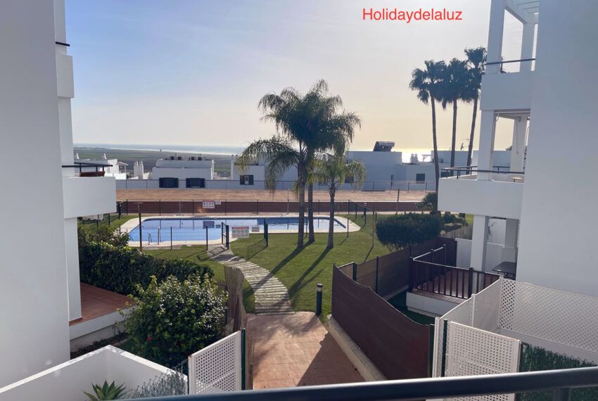 Apartment Miguel - apartment in Conil de la Frontera for rent - Holidaydelaluz - Balcony overlooking the community pool + Atlantic Ocean