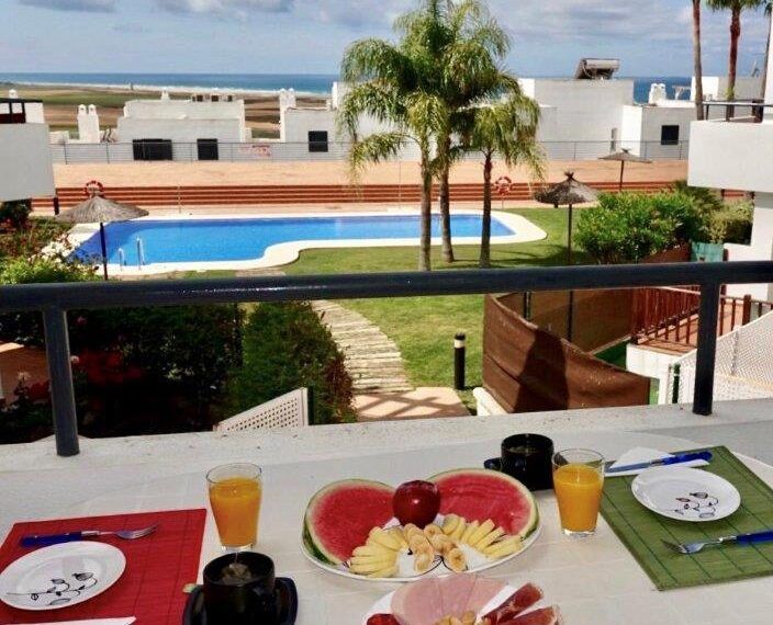 Apartment Miguel - apartment in Conil de la Frontera for rent - Holidaydelaluz - view of the community pool and Atlantic Ocean