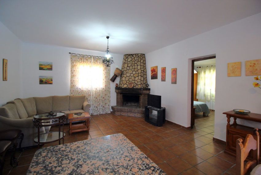 Casa Delfín - Ferienhaus in Roche Viejo mieten - Wohnzimmer - Kamin - Eingang zum Schlafzimmer 1
